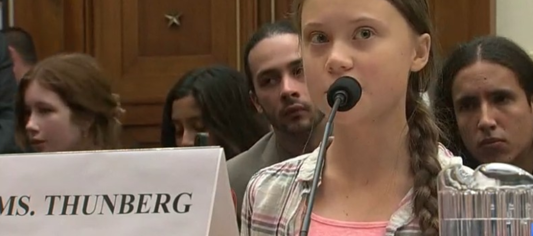 A girl is speaking at the hearing room